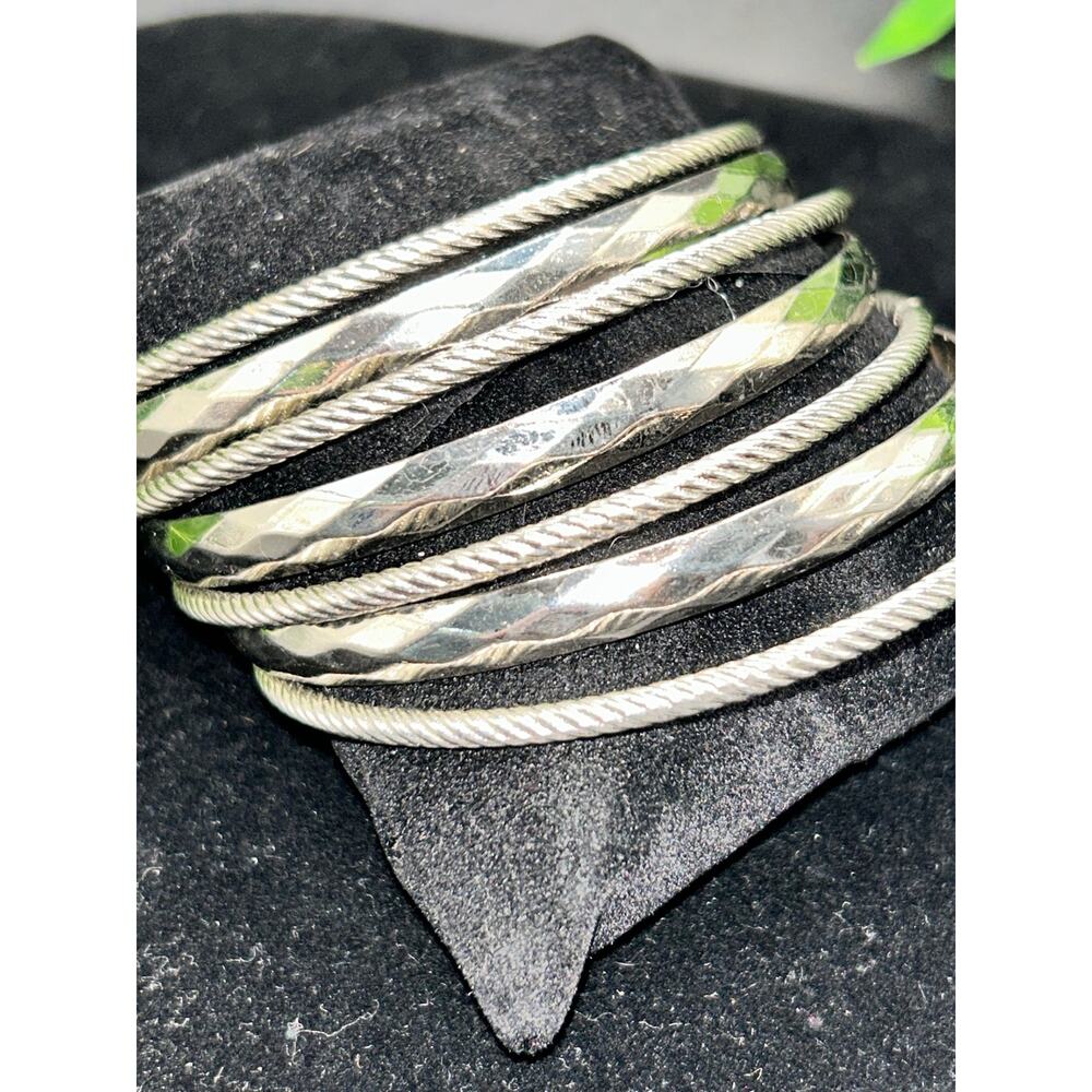 Set of 7 High-Polish Silver Tone Interlocking Bangle Bracelets Stacked Statement